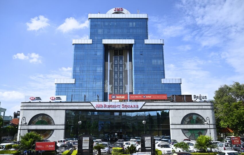 Front view of JMD Regent Square, a landmark corporate building offering premium commercial space for lease in a prime business location.