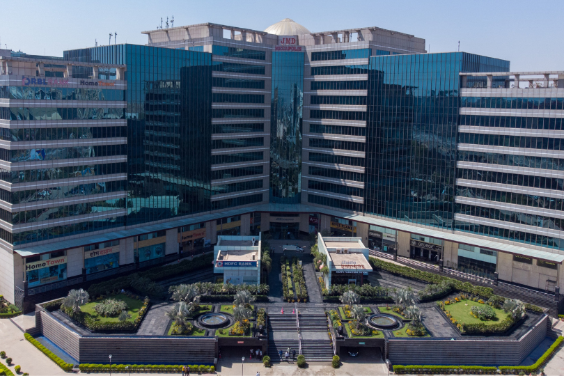 This is a JMD Megapolis building displaying the modern IT park's architectural exterior, a premier development offering premium retail hubs and commercial space for lease in Sector 48, Gurugram.