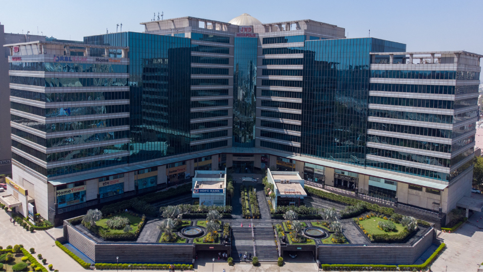 This is a JMD Megapolis building displaying the modern IT park's architectural exterior, a premier development offering premium retail hubs and commercial space for lease in Sector 48, Gurugram.