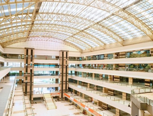 This is an internal view of JMD Empire Square commercial complex in Sector 28 Gurugram, highlighting premium multi-tier office corridors and the open-air architectural layout of the tech park.