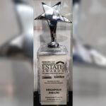 Estate Award trophy honoring JMD Group as a leading real estate developer for retail hubs and corporate offices.
