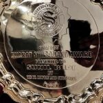 Bharat Shiromani Award trophy presented to JMD Group for significant contributions to real estate development in India.