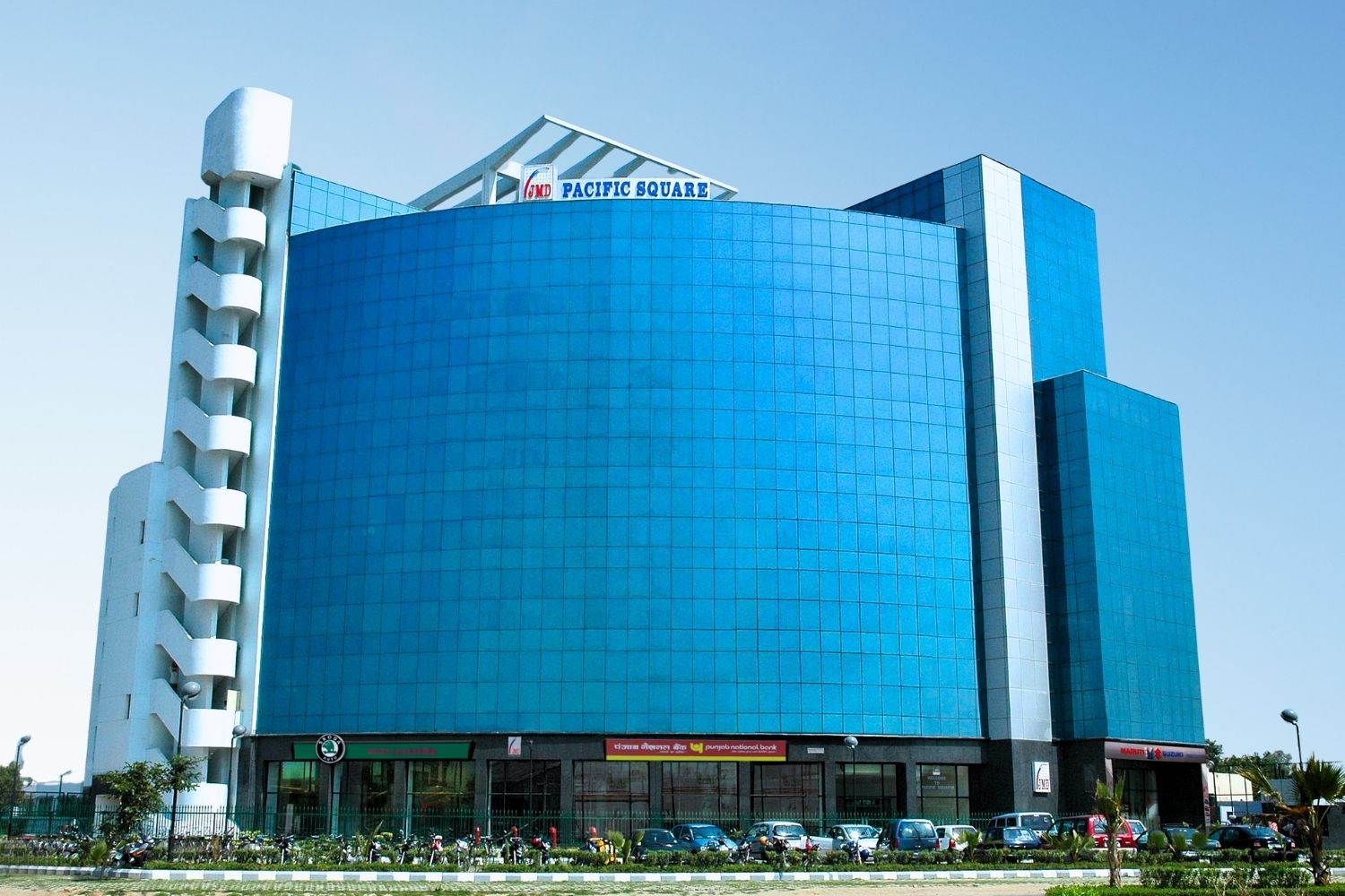 High-rise blue glass building of JMD Pacific Square.
