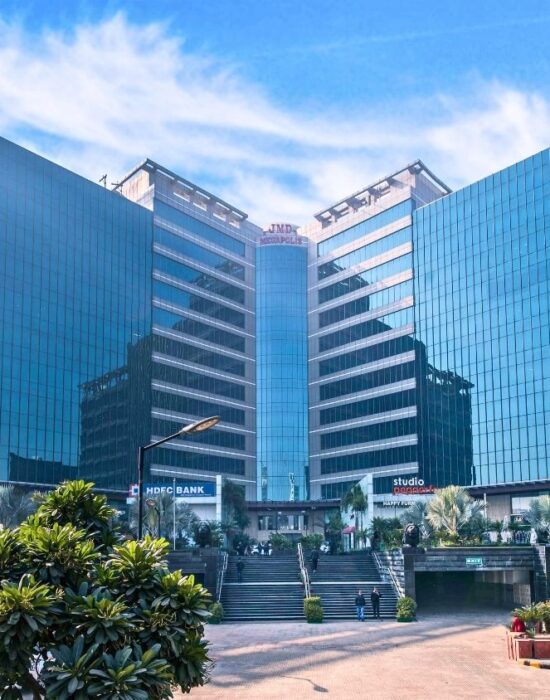 JMD Megapolis commercial property in Gurugram featuring modern urban architecture, glass facade office spaces, and retail shops.