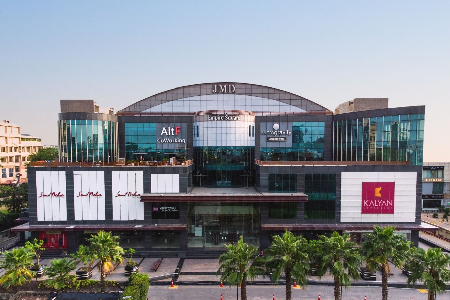 Front facade of JMD Empire Square commercial building featuring AltF CoWorking and Kalyan Jewellers storefronts